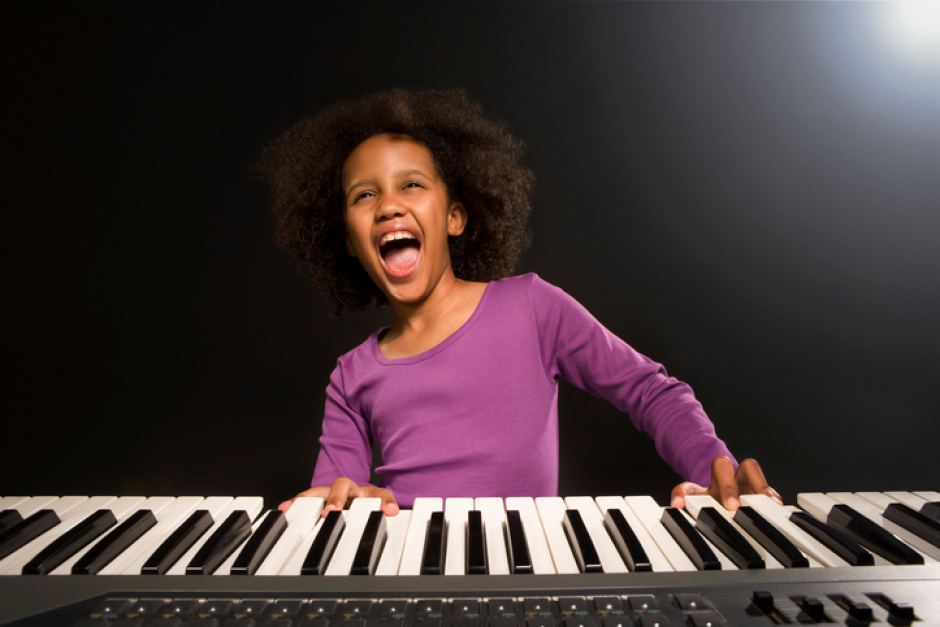 Little girl awesome on keyboard